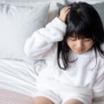 頭痛に悩む子供